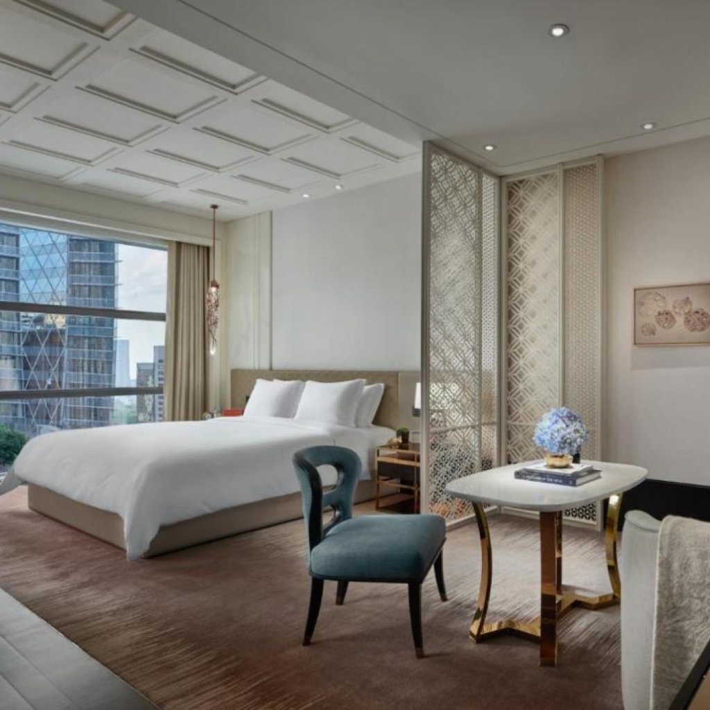 Rosewood Bangkok hotel interior bedroom featuring curated contemporary Thai art