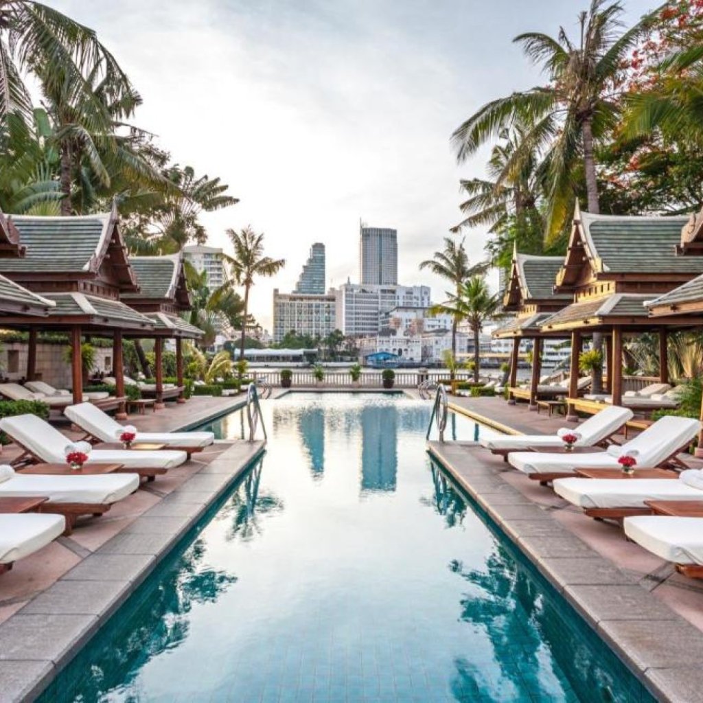 The Peninsula Bangkok tri-level pool terrace overlooking the Chao Phraya River