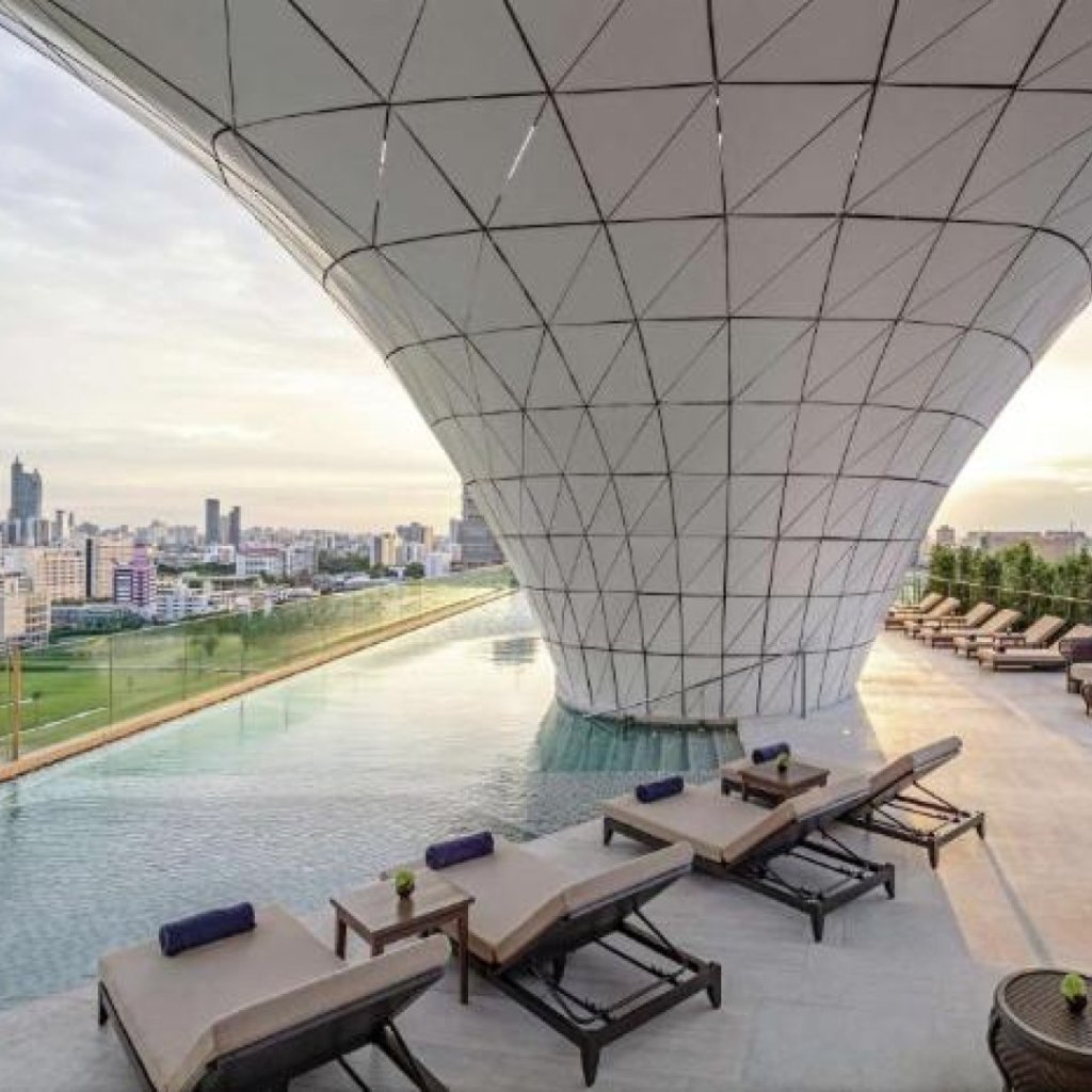 Waldorf Astoria Bangkok rooftop infinity pool overlooking the Siam district skyline